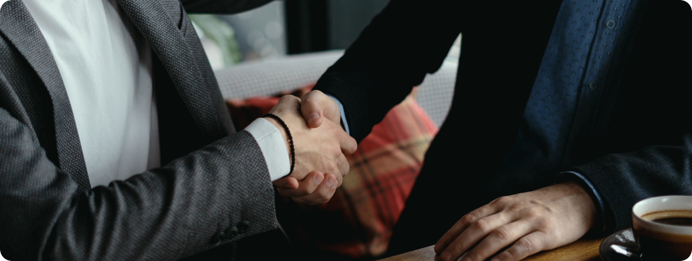 Business partnership handshake